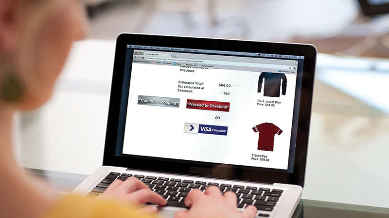 visa-checkout-laptop-800x450 A woman with a laptop doing some online shopping on a website that has Visa Checkout.