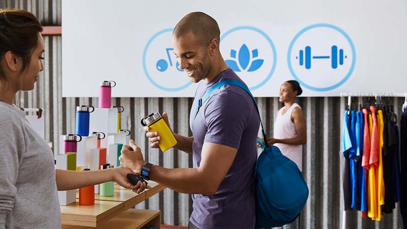 Man making payment on watch