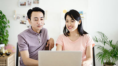 Young couple looking at a laptop