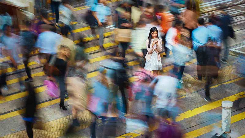 Women standing in a busy crossing