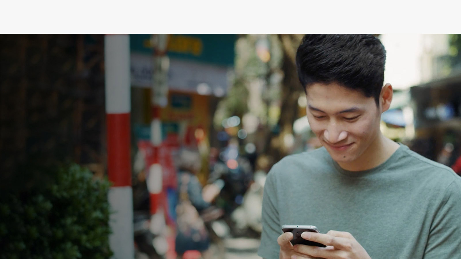 A man using mobile phone in the street