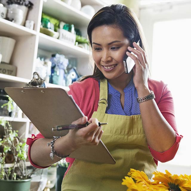 lady-holding-file-on-phone-flowers