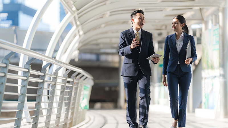 vsa-1-800x450 man and women in suit walking and chatting