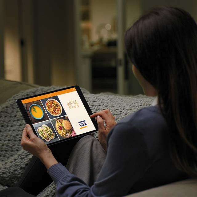 lady using tablet on couch